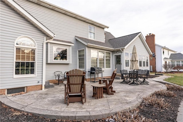 back of property with a patio area