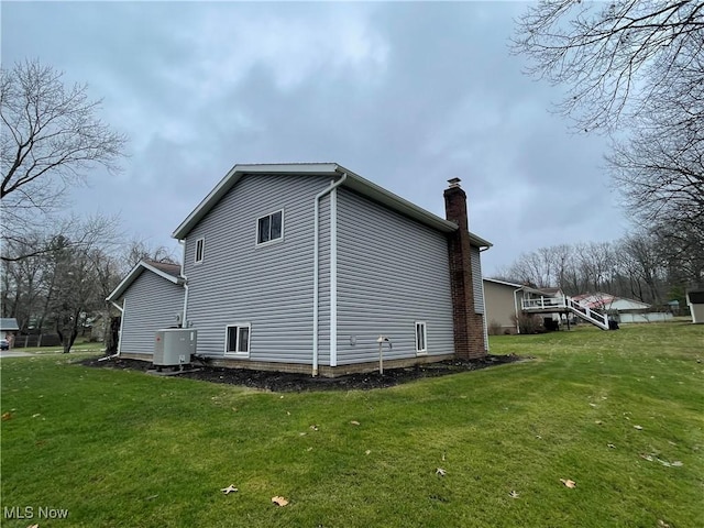 view of side of home featuring a yard