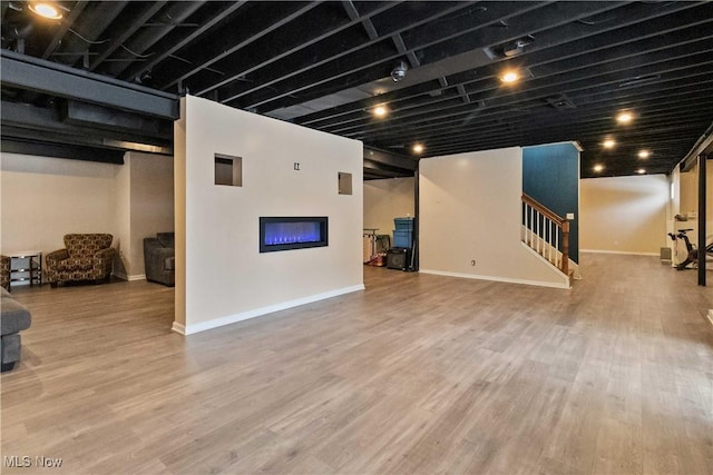 basement featuring wood-type flooring