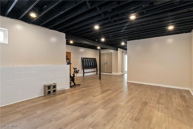 basement featuring light wood-type flooring