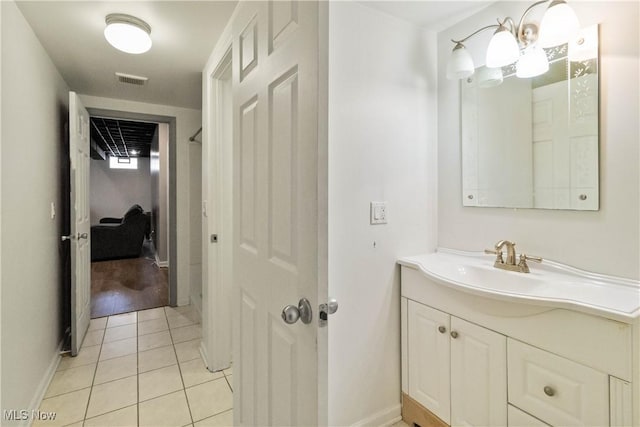 bathroom featuring tile patterned floors and vanity