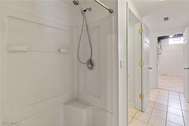 bathroom featuring a shower and tile patterned floors