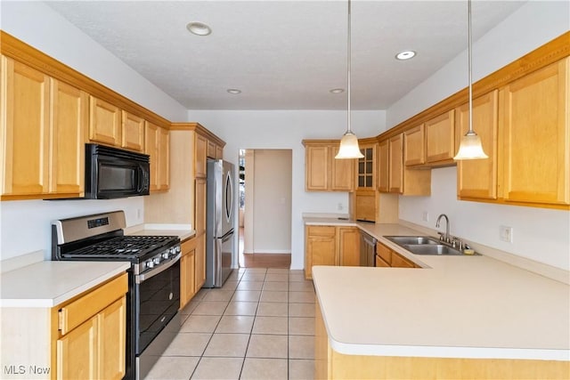 kitchen featuring appliances with stainless steel finishes, decorative light fixtures, light tile patterned floors, and sink