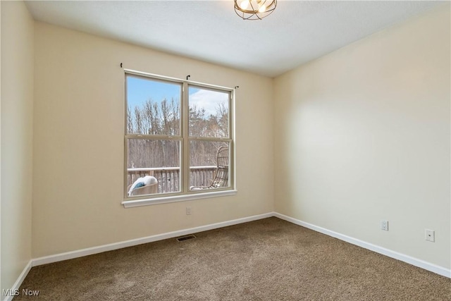 spare room featuring carpet flooring