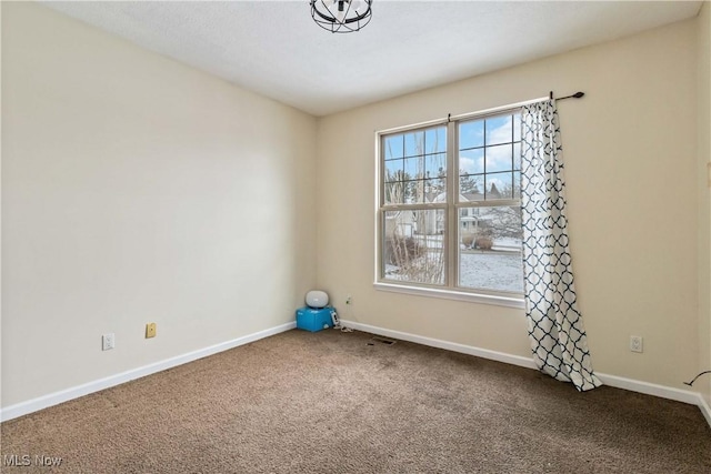 spare room featuring carpet flooring