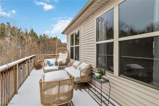 wooden balcony featuring a deck