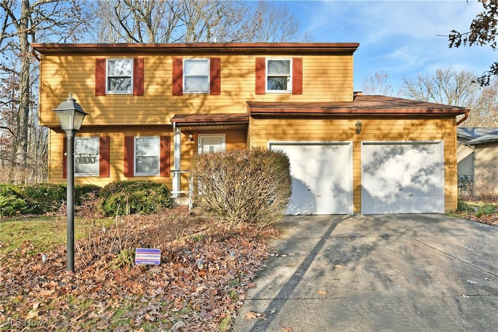 view of front of property with a garage