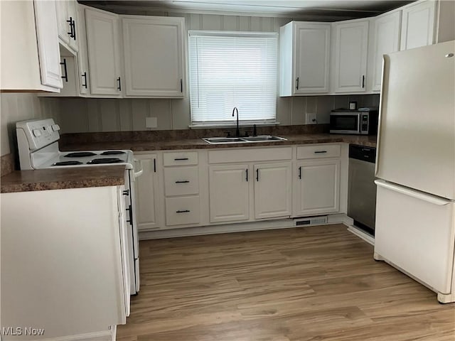 kitchen featuring white cabinetry, sink, and appliances with stainless steel finishes