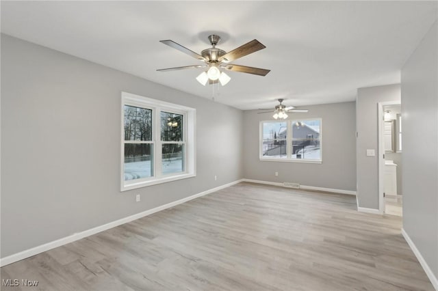 unfurnished room with light hardwood / wood-style flooring and ceiling fan