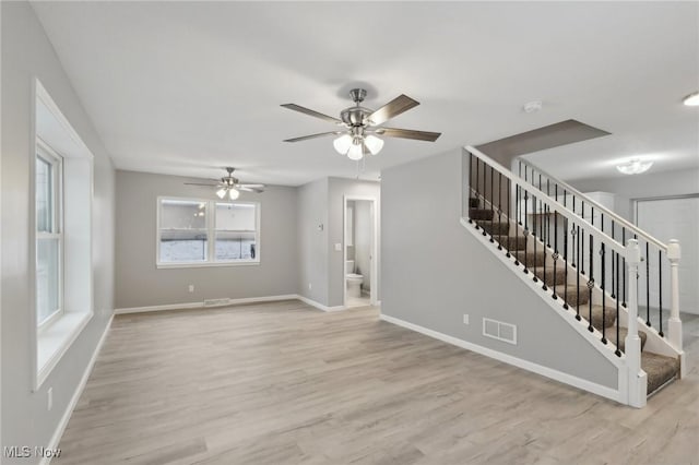 interior space featuring ceiling fan and light hardwood / wood-style flooring