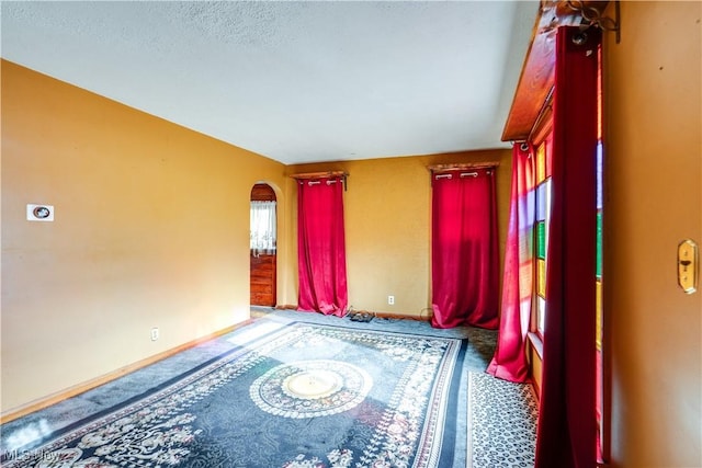 empty room with a textured ceiling