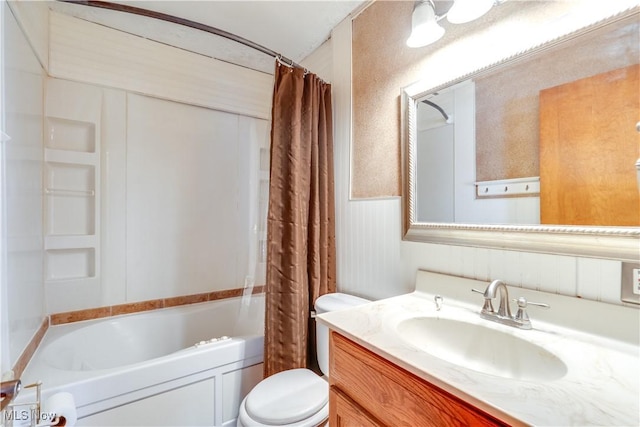 full bathroom featuring shower / bathtub combination with curtain, vanity, and toilet