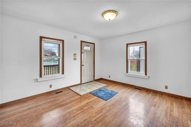 foyer entrance featuring light wood-type flooring