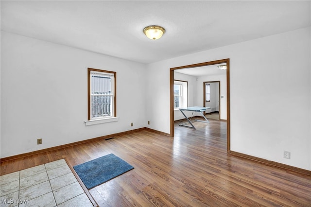 spare room featuring hardwood / wood-style floors