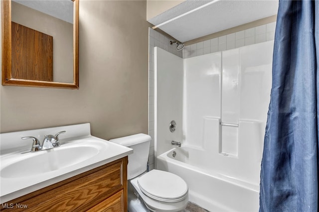 full bathroom featuring shower / bath combo with shower curtain, vanity, and toilet