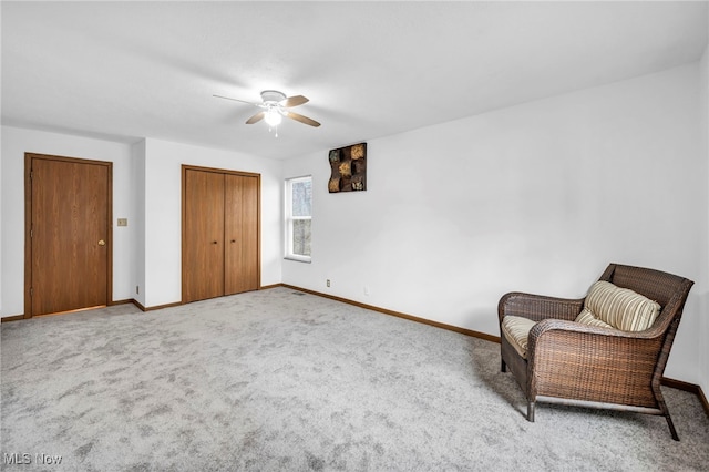 unfurnished room with carpet flooring and ceiling fan