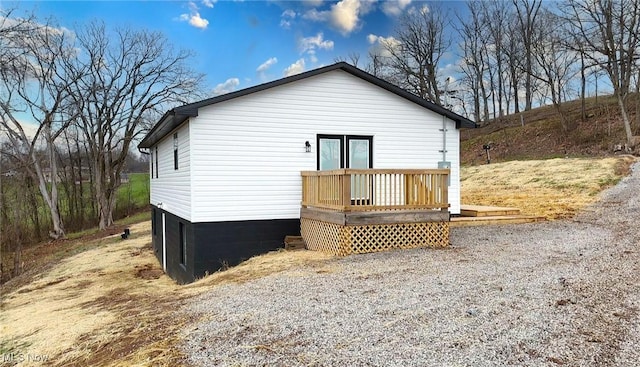 view of home's exterior with a deck