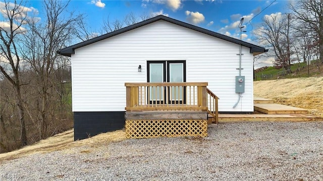 back of property featuring a deck