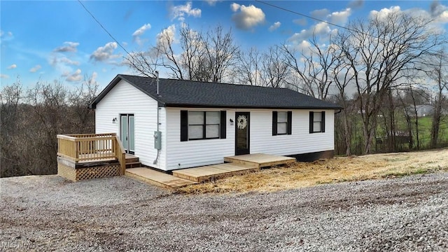 view of front of home featuring a wooden deck