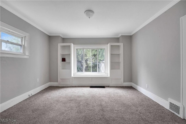 empty room with carpet flooring and ornamental molding