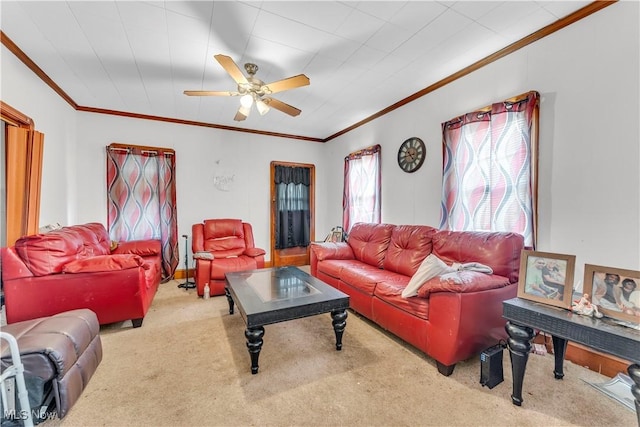 living room featuring carpet flooring, ceiling fan, and crown molding