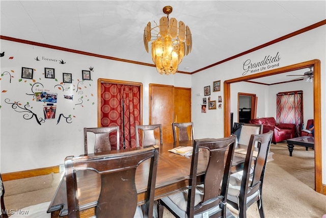 dining area featuring light carpet, ornamental molding, and an inviting chandelier