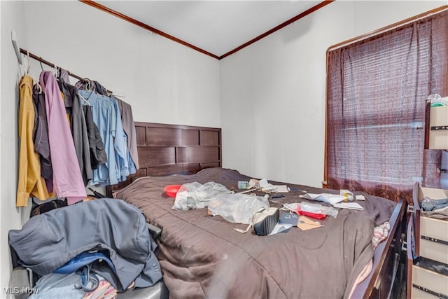 bedroom with ornamental molding