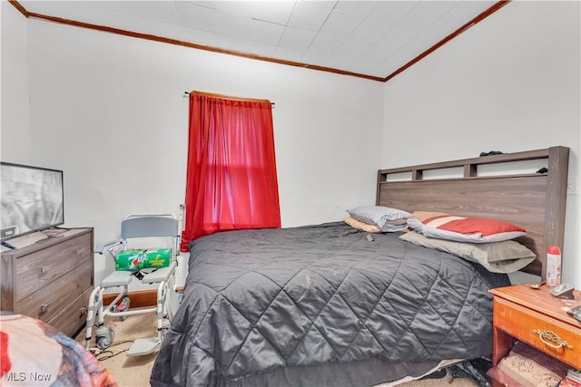 bedroom with carpet flooring and crown molding