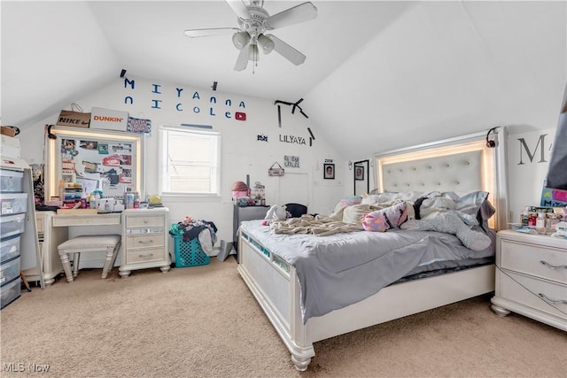 carpeted bedroom with ceiling fan and lofted ceiling