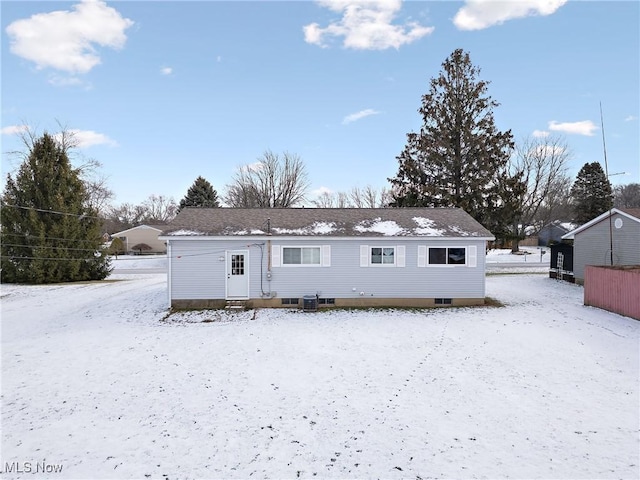 snow covered property featuring cooling unit