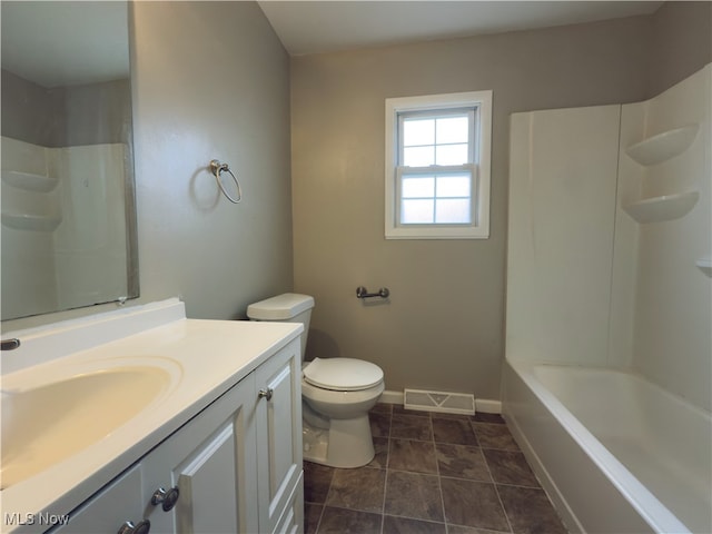 full bathroom with washtub / shower combination, vanity, and toilet