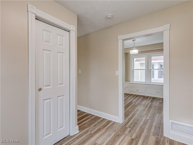 hallway featuring light hardwood / wood-style flooring