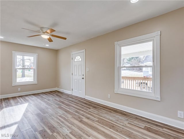 foyer entrance featuring light hardwood / wood-style flooring and ceiling fan