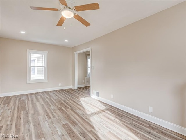 unfurnished room with light hardwood / wood-style flooring and ceiling fan