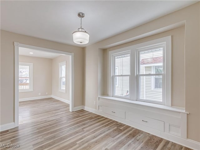 unfurnished room with light hardwood / wood-style floors