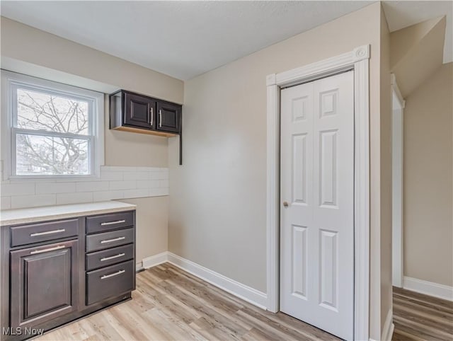 kitchen featuring decorative backsplash and light hardwood / wood-style floors