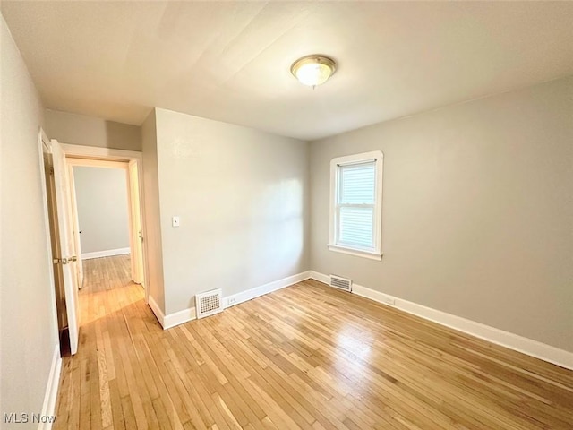 unfurnished room featuring light hardwood / wood-style floors