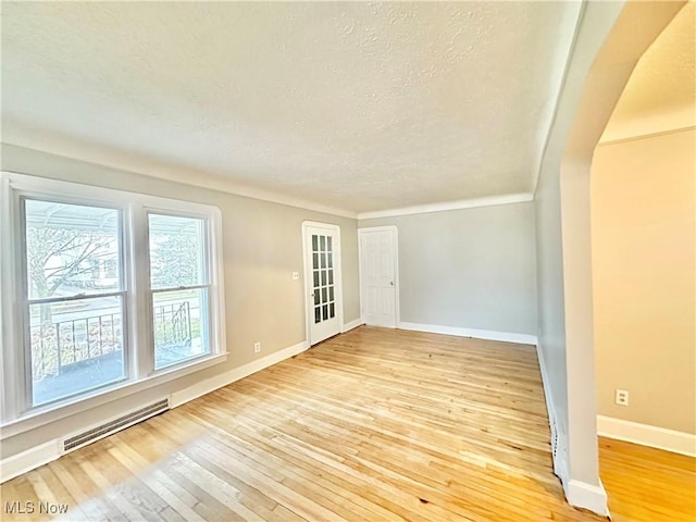 empty room with hardwood / wood-style floors