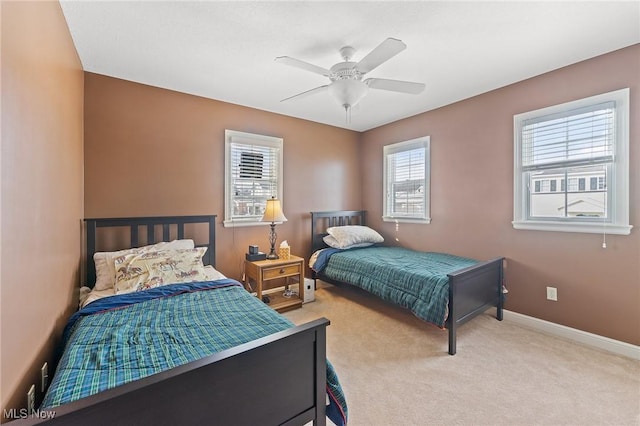 bedroom featuring ceiling fan and light colored carpet