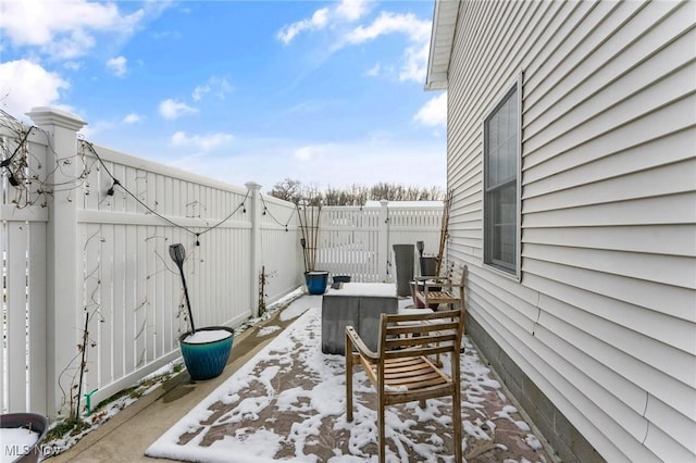 view of snow covered patio