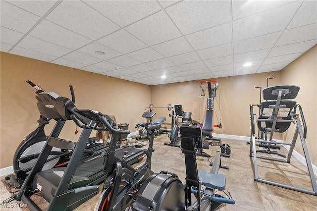 workout room featuring a paneled ceiling