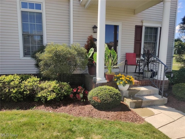 doorway to property with covered porch