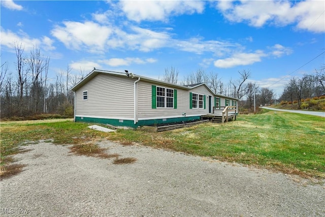 view of side of home featuring a lawn