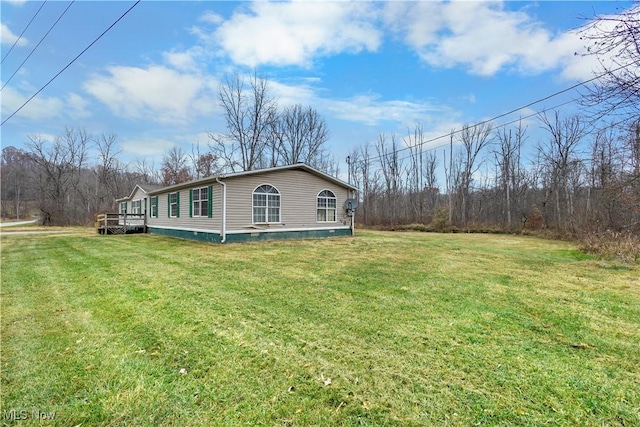 view of home's exterior with a yard