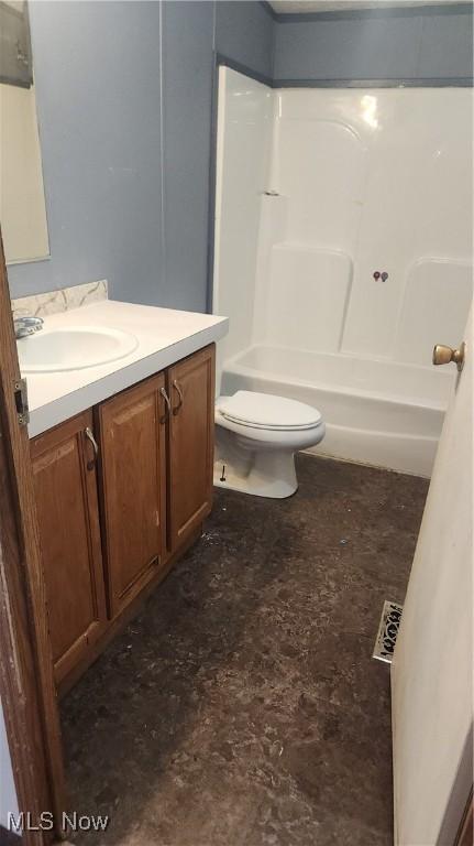 full bathroom with vanity, tub / shower combination, and toilet