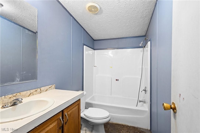 full bathroom with vanity,  shower combination, toilet, and a textured ceiling