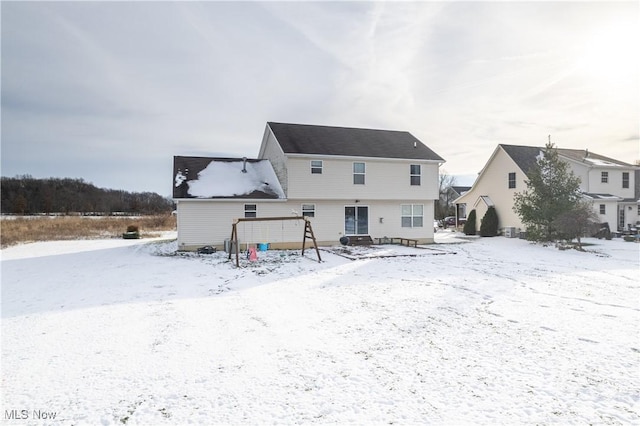 view of snow covered house