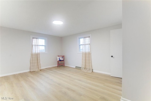 unfurnished room featuring light hardwood / wood-style flooring