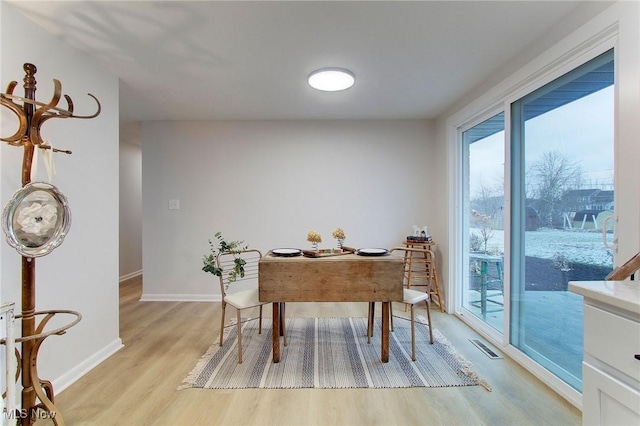 office area with light hardwood / wood-style flooring