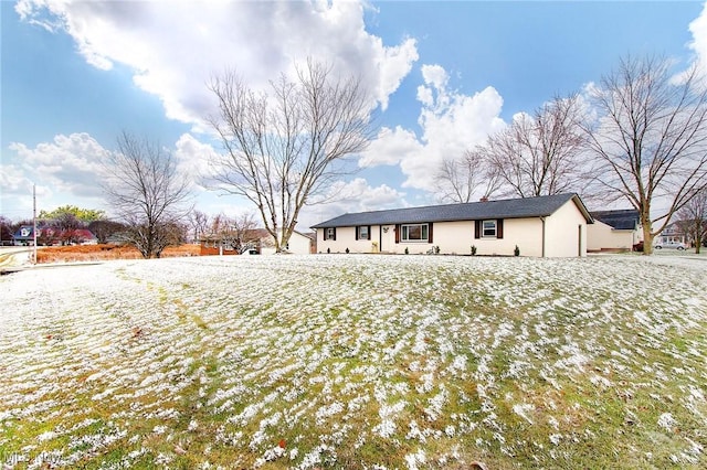 view of snow covered back of property